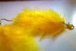 Boucles d'oreilles plumes jaunes: 5 € soldées 2,50 €